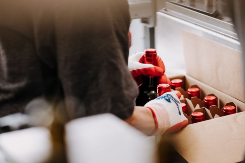 River Stone wine bottles being placed into shipping cartons