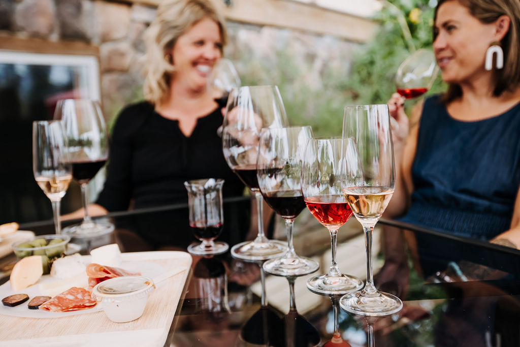 People sitting at a table enjoying River Stone Wine
